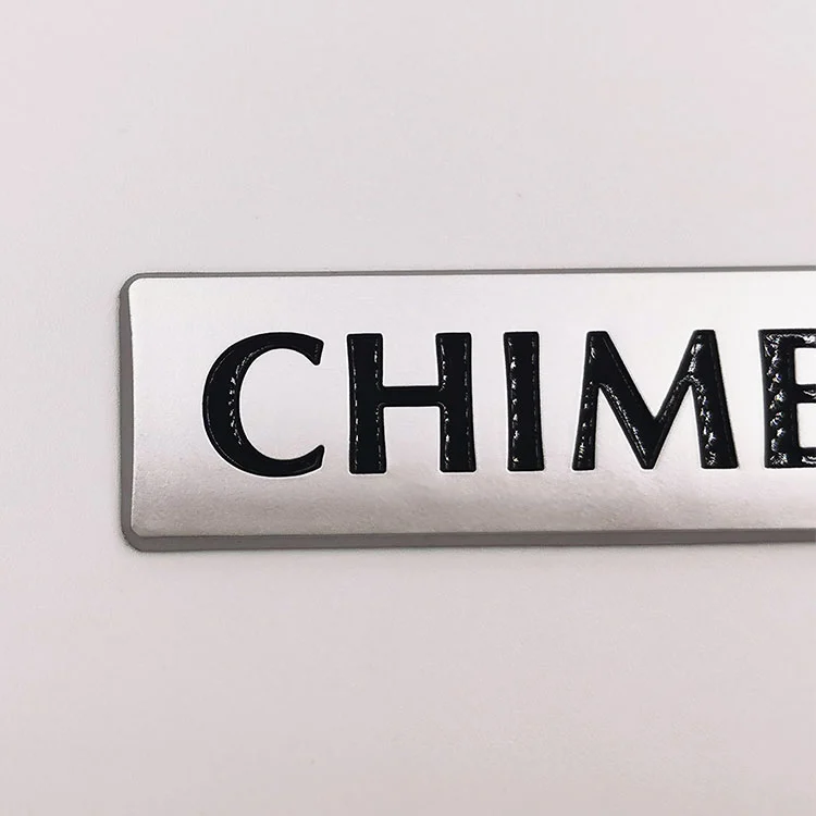 Logotipo en relieve en 3D de plástico ABS
