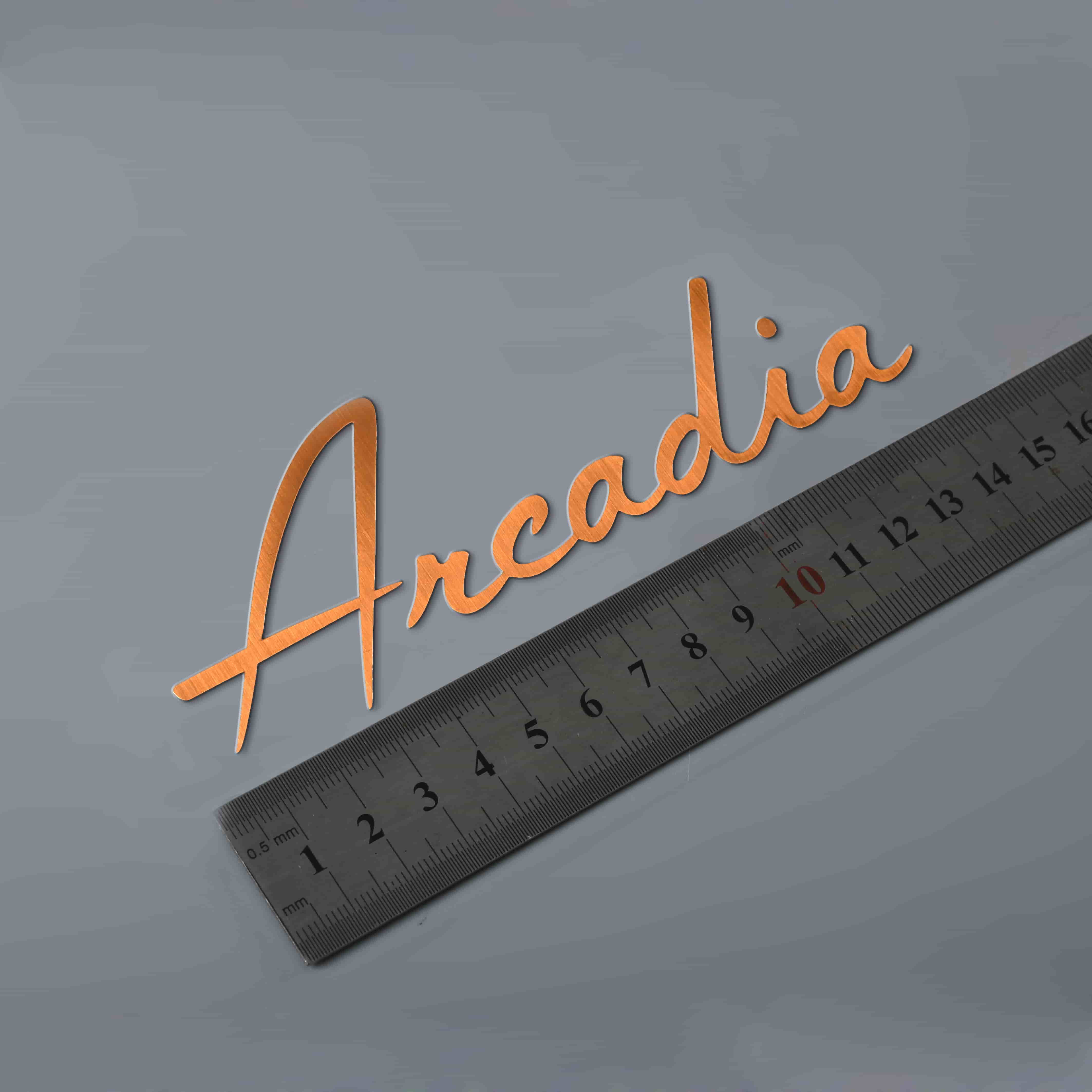 Logotipo de electroformado adhesivo de níquel en relieve